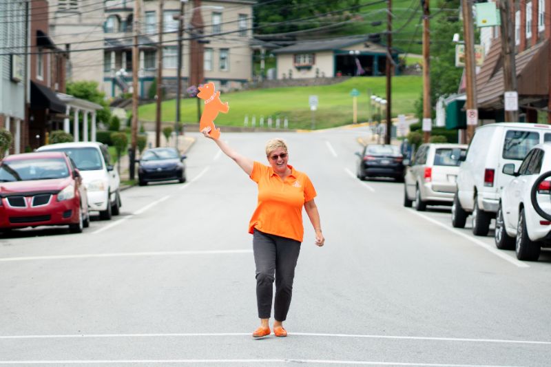 outdoor patio with blue couch and hanging lights