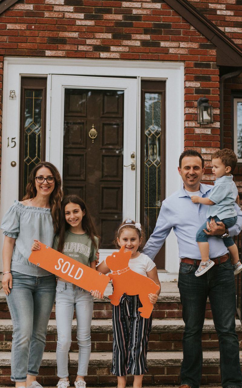 kitchen counter island with white cabinets and wood floors